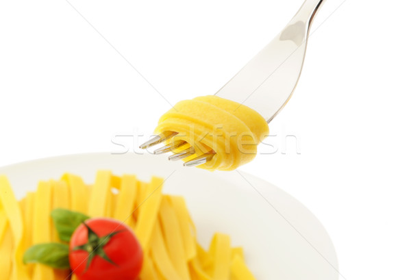 Stock photo: Rolled spaghetti on a fork, italian food