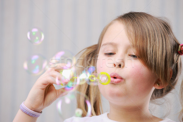 Little girll blowing bubbles Stock photo © stokkete