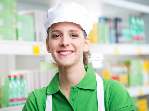 Female sales clerk working at supermarket Stock photo © stokkete
