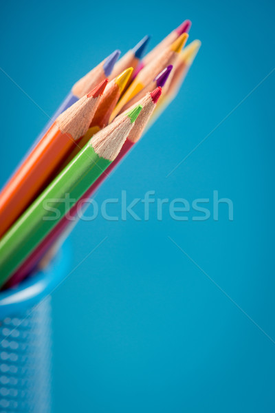 Colorful pencils in blue basket holder Stock photo © stokkete