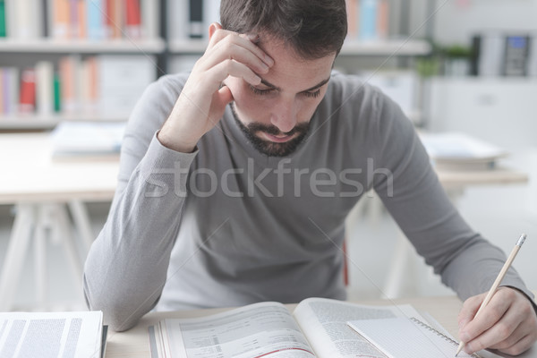 Man studying at the library Stock photo © stokkete