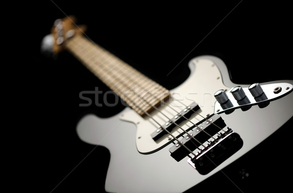 close up of a black electric bass glossy on dark background Stock photo © stokkete