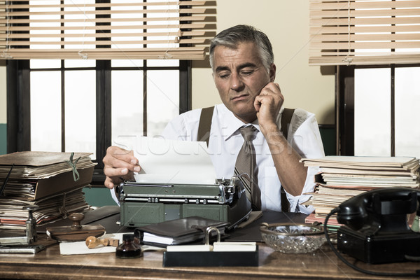 Disappointed office worker working at desk Stock photo © stokkete