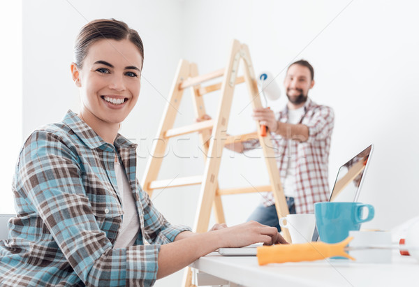 Happy couple remodeling their house Stock photo © stokkete