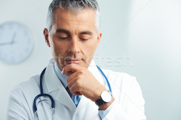 Retrato bonito médico masculino pensando homem Foto stock © stokkete