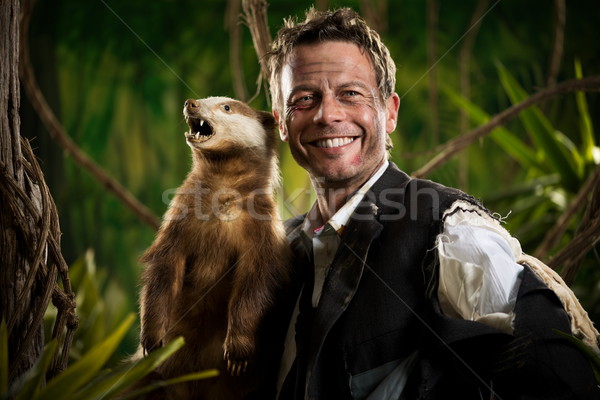 Geschäftsmann posiert Dachs heiter zerrissen Kleidung Stock foto © stokkete