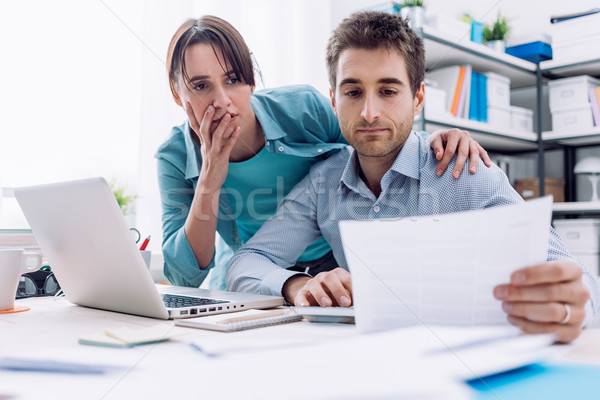 Couple checking bills at home Stock photo © stokkete