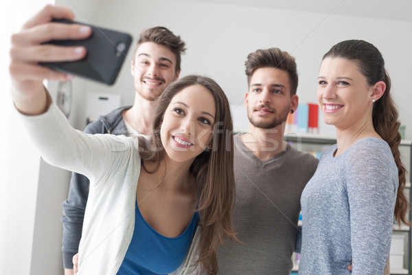 Teenagers taking selfies with a mobile phone Stock photo © stokkete