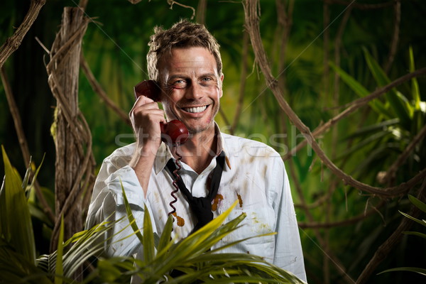 Telefoongesprek jungle wildernis aantrekkelijk glimlachend zakenman Stockfoto © stokkete