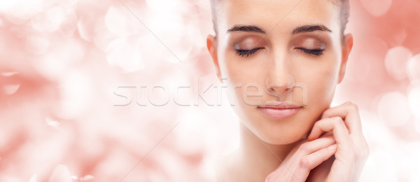 Beautiful woman touching her smooth skin Stock photo © stokkete