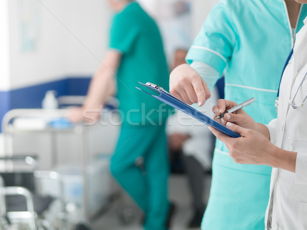 Doctors checking medical records Stock photo © stokkete