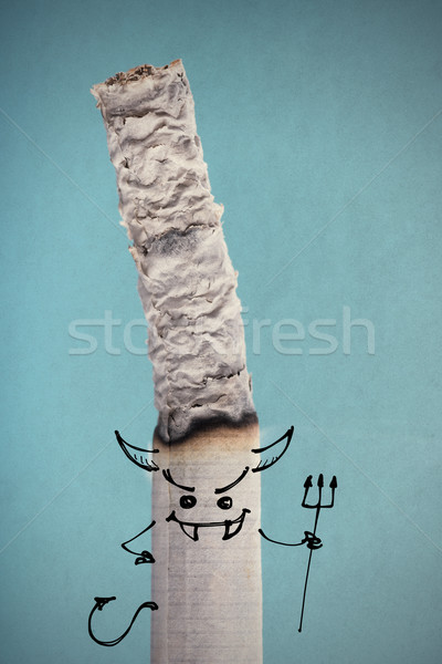 Brucia sigaretta divertente carattere diavolo fumare Foto d'archivio © stokkete