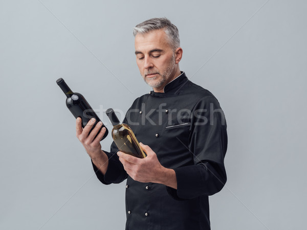 Chef choosing a wine bottle Stock photo © stokkete