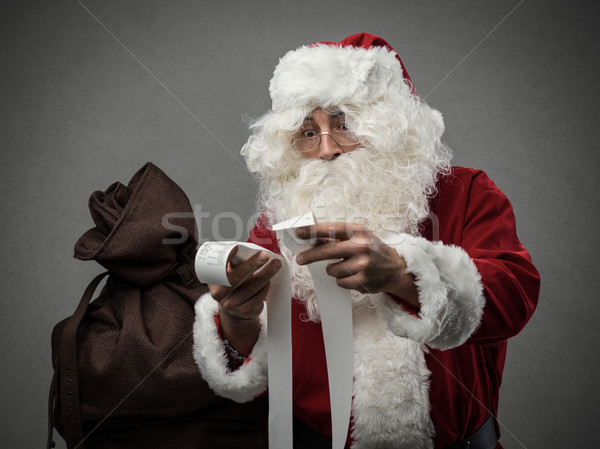 Santa Claus checking bills Stock photo © stokkete