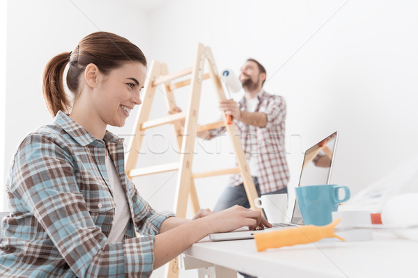 Happy couple remodeling their house Stock photo © stokkete