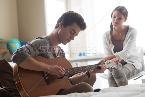 ロマンチックな 少年 演奏 ギター ガールフレンド 小さな ストックフォト © stokkete