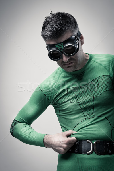 Superhero pinching his belly Stock photo © stokkete