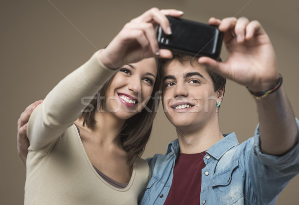 Young couple taking selfies Stock photo © stokkete