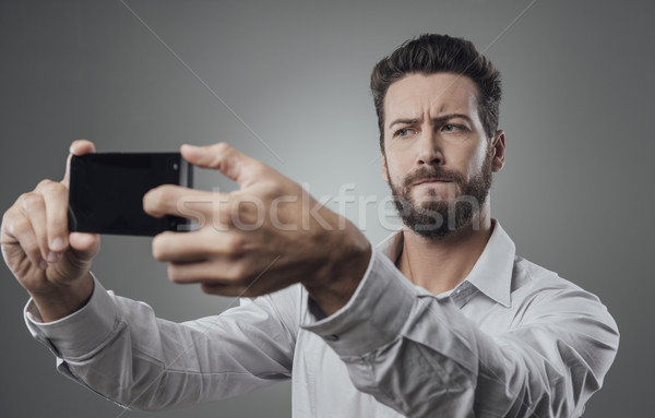 Cool man taking a selfie Stock photo © stokkete