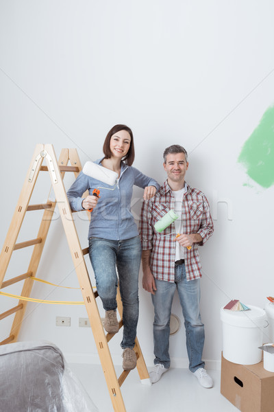 Happy couple renovating their home Stock photo © stokkete