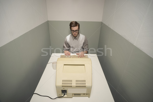 Vintage nerd on computer Stock photo © stokkete