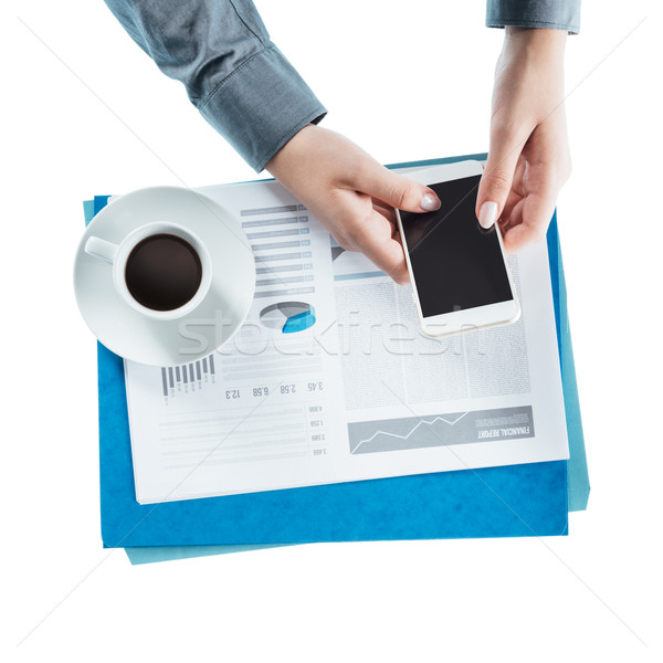 Business woman using a smart phone Stock photo © stokkete