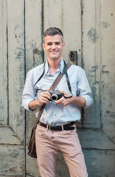 Tourist taking pictures in the street Stock photo © stokkete