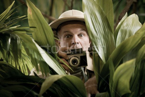 Stock photo: Explorer photographer hiding in vegetation