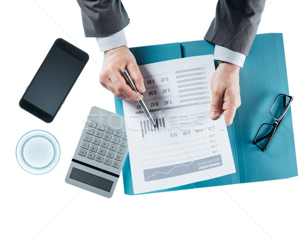 Business man checking a financial report Stock photo © stokkete