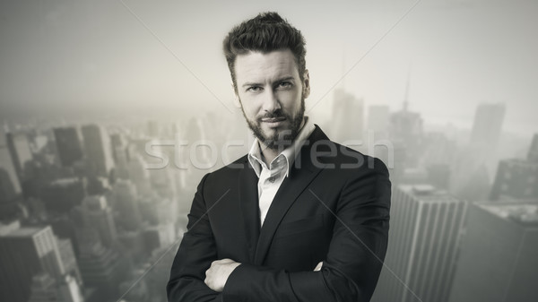 Confident young businessman posing Stock photo © stokkete