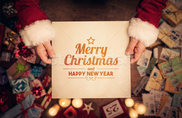 Vidám karácsony boldog új évet üzenet mikulás tart Stock fotó © stokkete