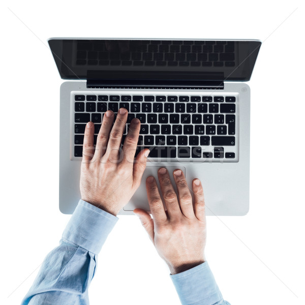 Businessman typing on a laptop Stock photo © stokkete
