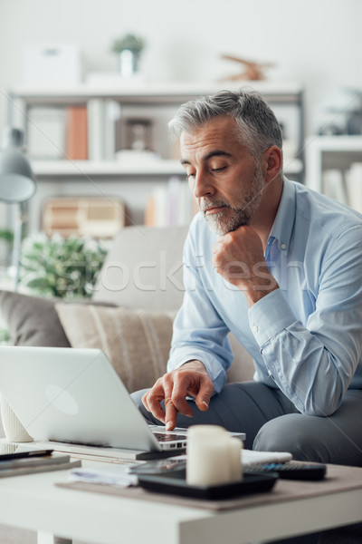 Businessman working at home Stock photo © stokkete