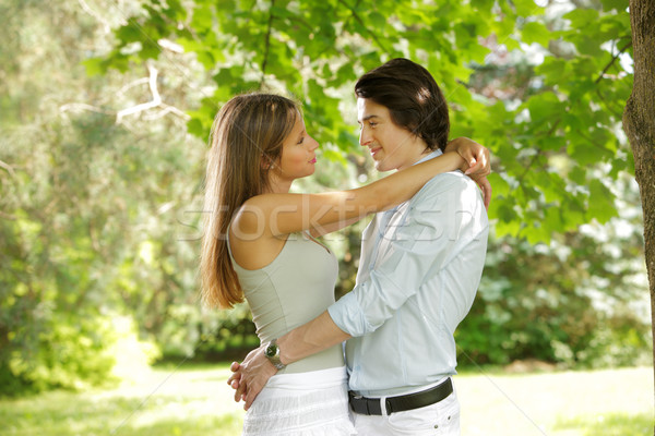 Young happy couple in the park  Stock photo © stokkete