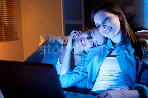 GIrlfriends on a sofa with laptop Stock photo © stokkete