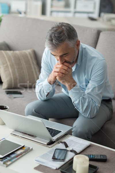 Businessman working at home Stock photo © stokkete