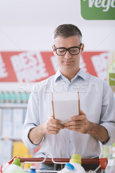 Man reading food labels Stock photo © stokkete