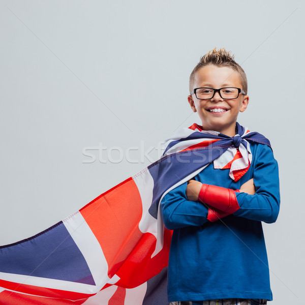 Smiling superhero boy with British flag cape Stock photo © stokkete