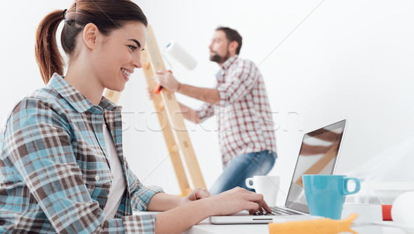 Happy couple remodeling their house Stock photo © stokkete