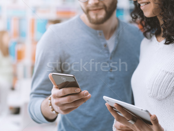 Friends sharing social media contents Stock photo © stokkete
