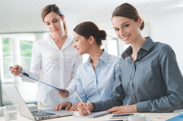 Business women team working at desk Stock photo © stokkete