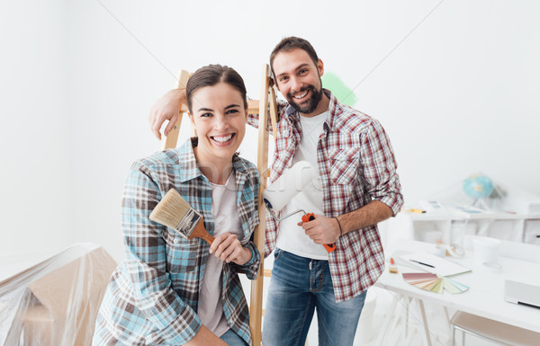 Creative couple renovating their house Stock photo © stokkete
