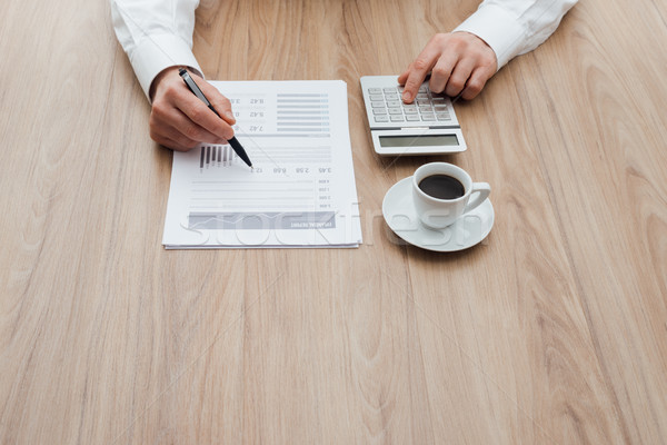 Businessman checking financial reports Stock photo © stokkete