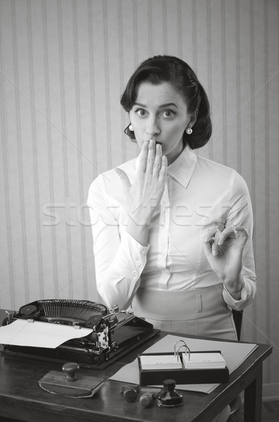 Retro office worker with surprised expression Stock photo © stokkete