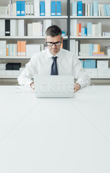 Businessman working with a laptop Stock photo © stokkete