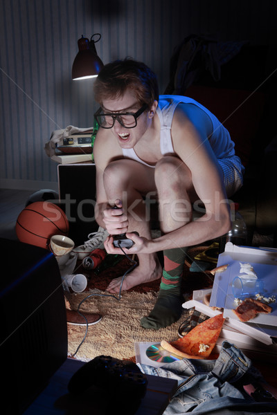 Gamer nerd playing video games on television Stock photo © stokkete