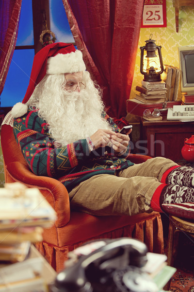 Santa Claus and smartphone Stock photo © stokkete