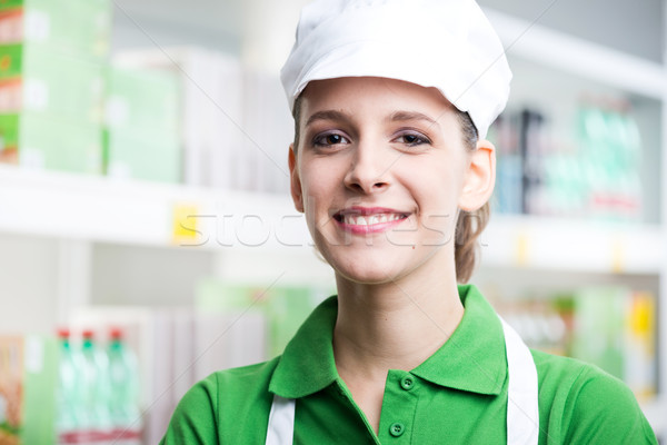 Female sales clerk working at supermarket Stock photo © stokkete