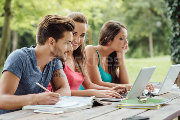 Stock photo: Teenagers studying outdoors