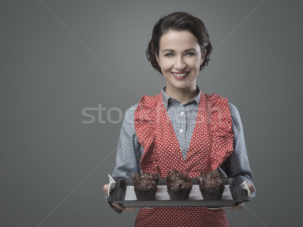 Vintage housewife with home made muffins Stock photo © stokkete